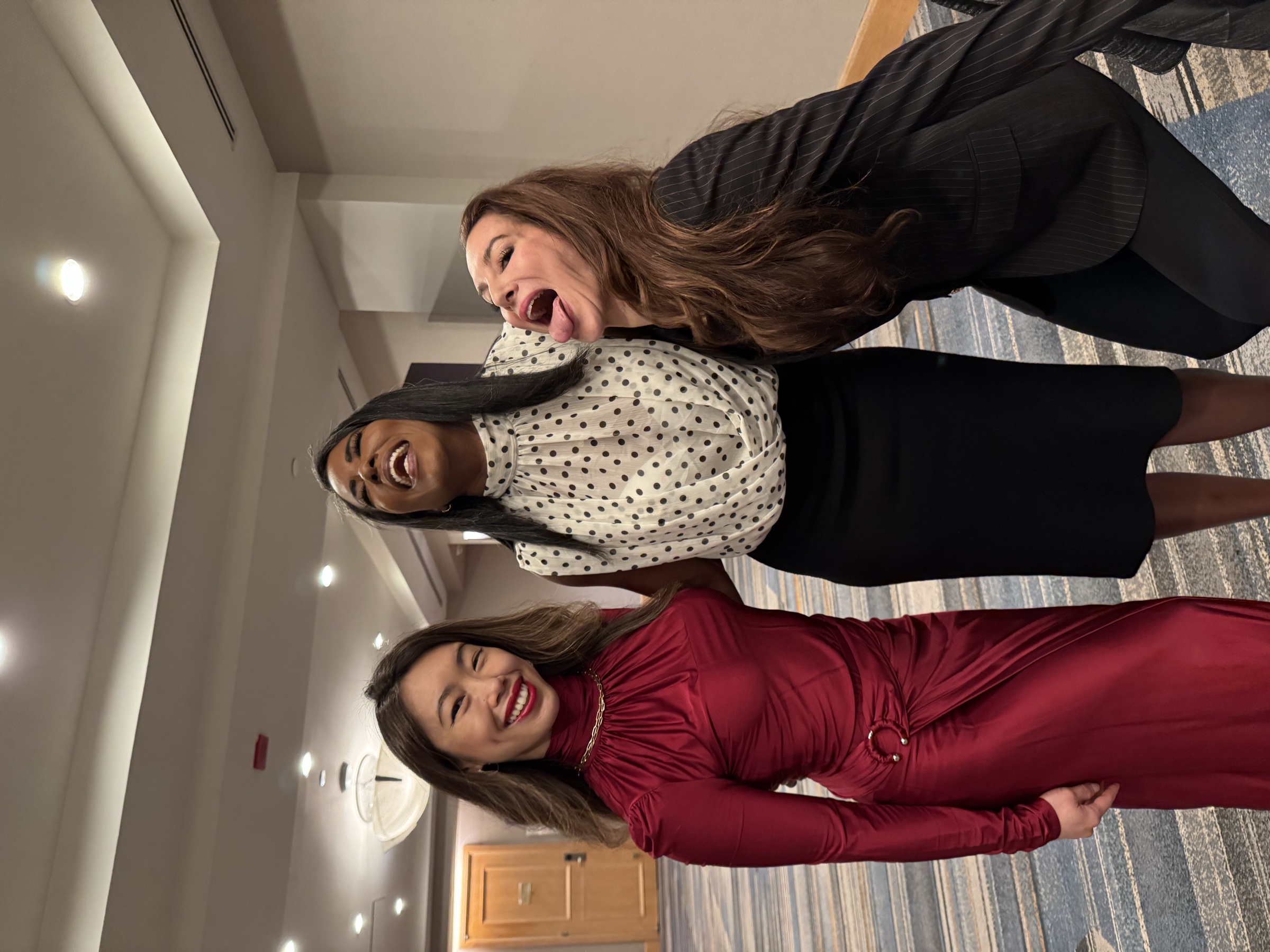 Hillary laughing with other women at Livelong